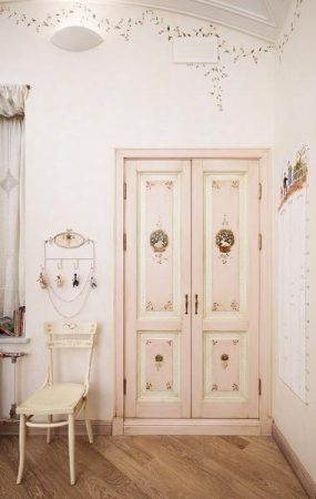 A room with a unique pink door.