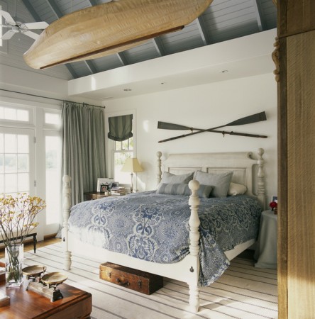 A Coastal Bedroom with a Canoe Bed.