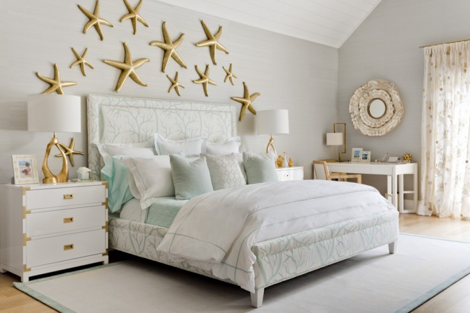 A white bed with starfish decor in a bedroom featured in the 20 Designer Showhouse Rooms.