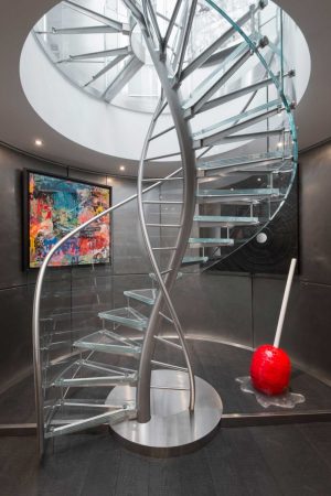 A modern home with sculptural elements including a spiral staircase.