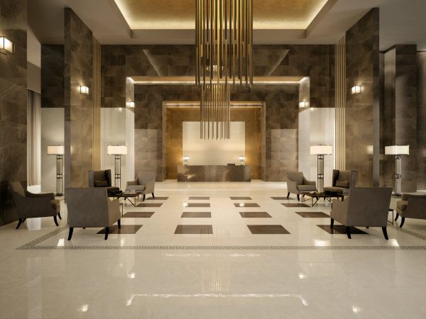 A lobby with porcelain floors and a chandelier.