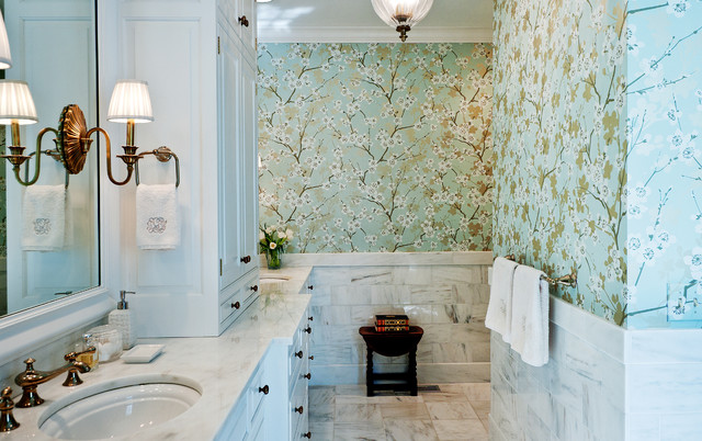 Guide on how to redecorate your bathroom on a budget using floral wallpaper and a sink.