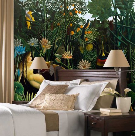 A tropical-themed bed in a room with a mural.