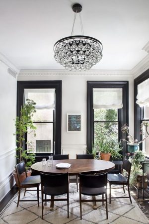 A statement dining room with a chandelier.