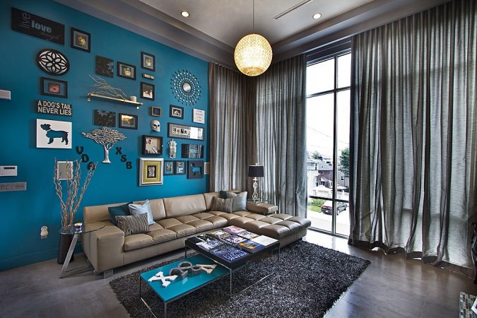 Statement: A living room with a blue wall is described.