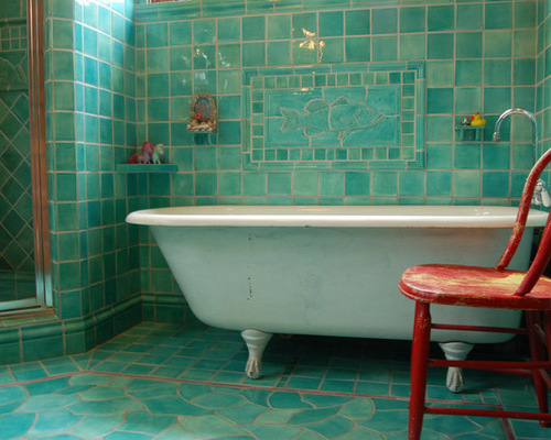 A beautifully tiled bathtub in a bathroom.