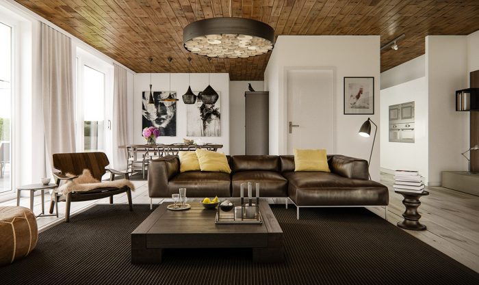 A living room with a brown leather Statement furniture and a wooden ceiling.