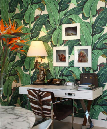 A tropical-inspired desk with a zebra print on it.