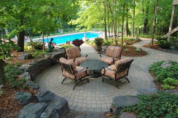 Cozy patio seating adjacent to pool area 
