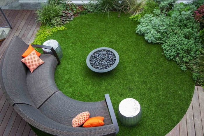 A backyard with a circular seating area.