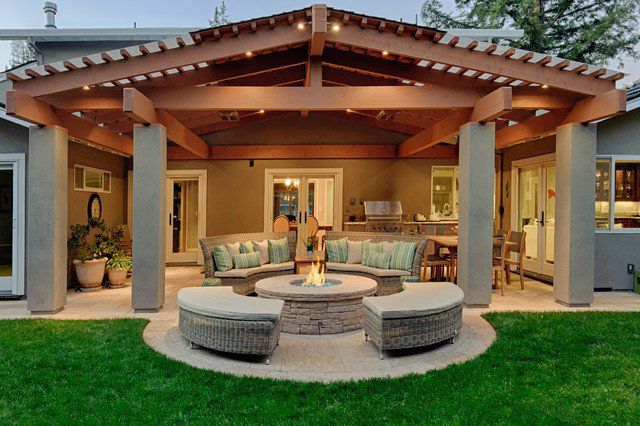 A backyard with a fire pit and patio furniture for patio ideas.