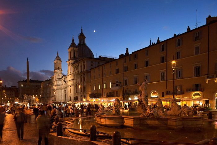 Piazza Navona in evening time with the shoppers whizzing by