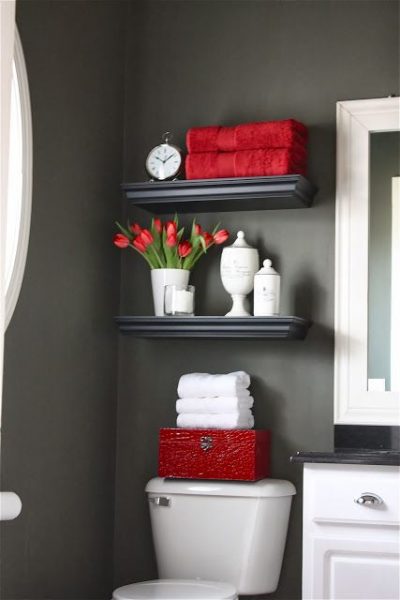 Red accessories pop out against a charcoal wall