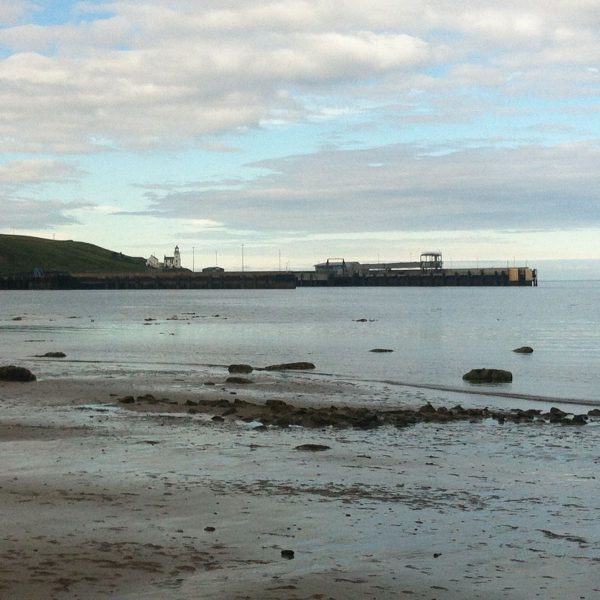 A view over the beach towards Scrabster Port. 