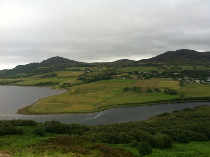 A view of a Scottish lake from a hillside.