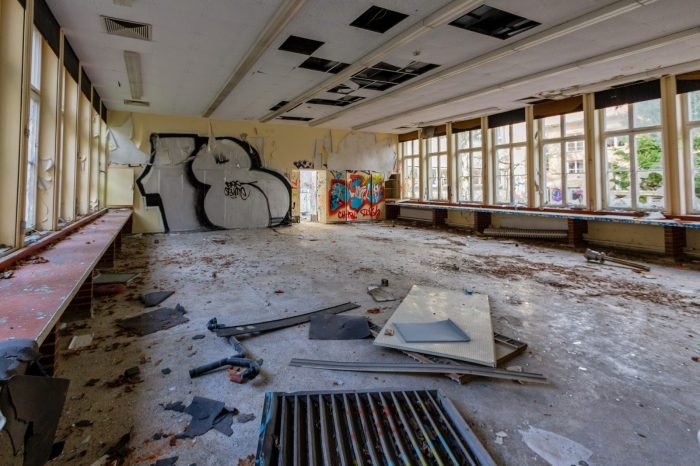 An abandoned room in Germany covered in graffiti.