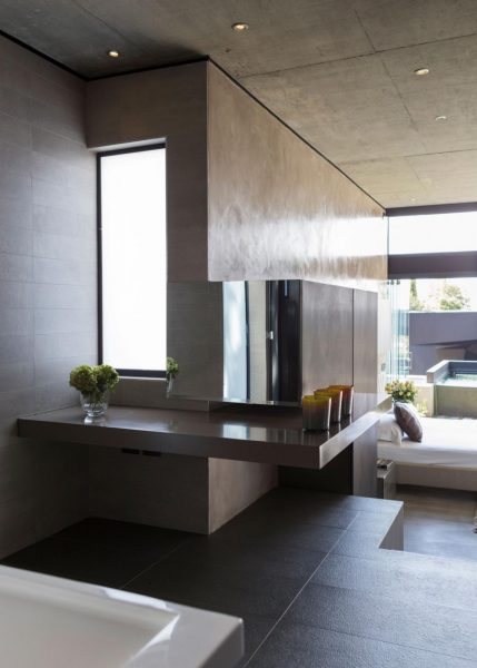 A modern bathroom in the Kloff Road House with a large tub and sink.