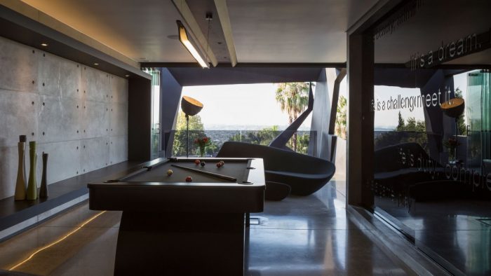 A room with a pool table and chairs at Kloff Road House.
