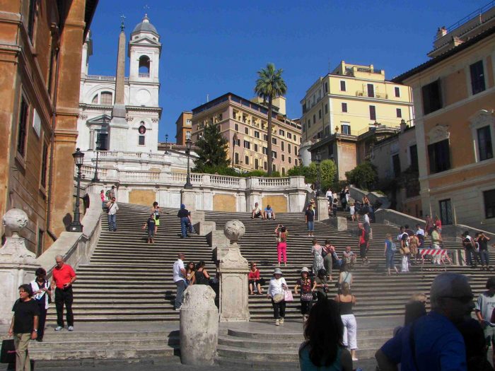 A group of people on the steps in Rome.