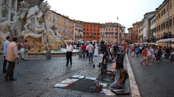 Urban life around the fountain in Piazza Navona