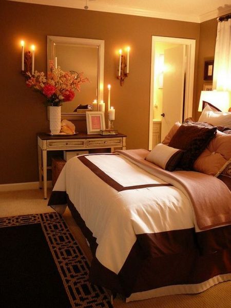 Candle sconces softly glow in a master bedroom. (http://www.homedit.com)