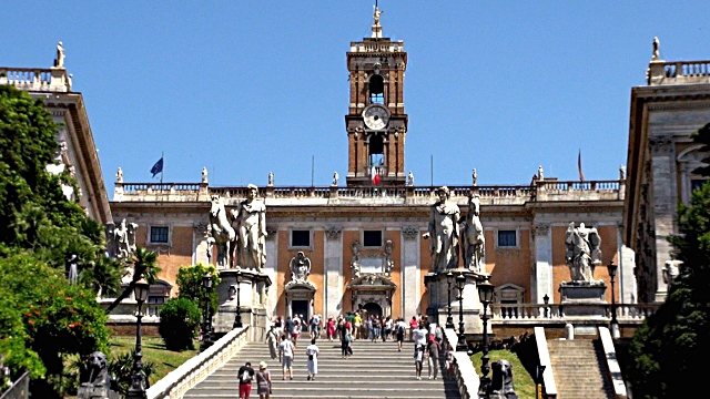 A large building with stairs leading up to it in Rome.