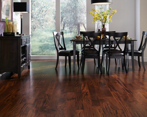 A dining room with hardwood flooring.