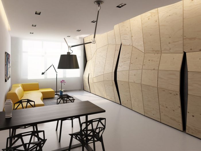 A living room with a faceted wooden wall.