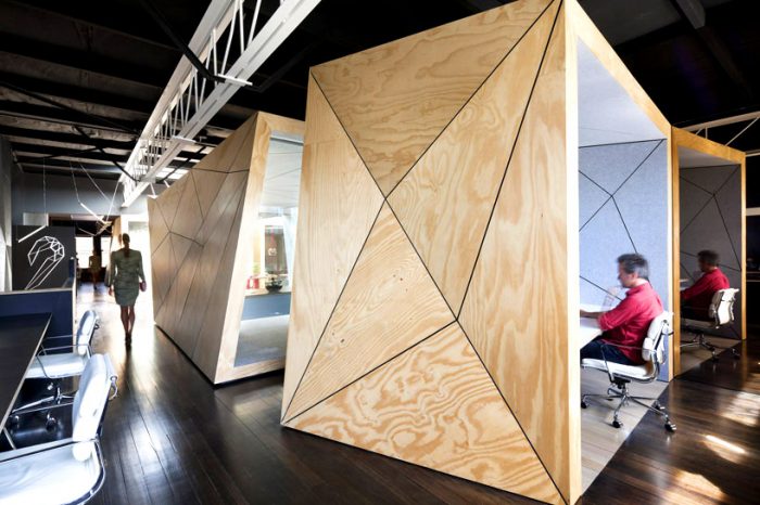 A faceted office with people working in it.