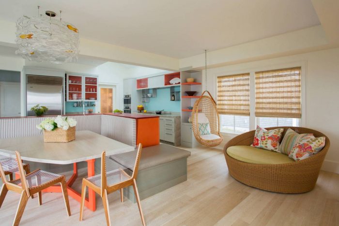 A bright and colorful kitchen with a dining table and chairs.