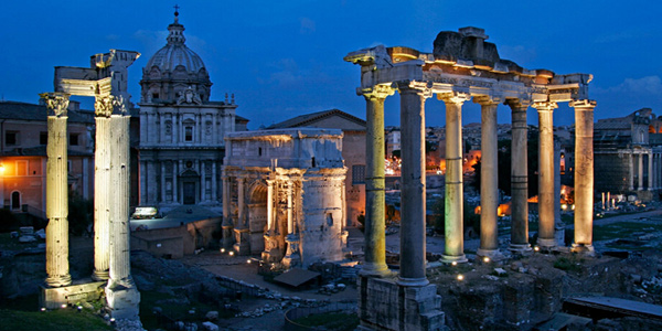 A view of the Roman Forum at night in Rome.