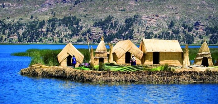 A group of huts on an island in the middle of Lake Titicaca in Peru.