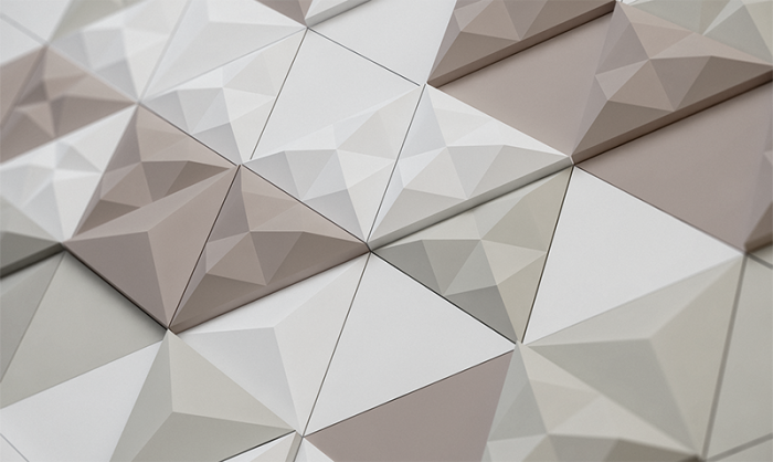 A close up image of a wall with faceted triangles.