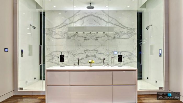 A stunning residence with a marble shower and sink.