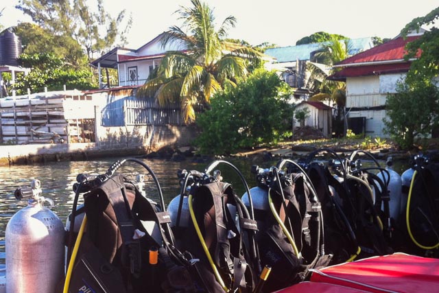 Boat with row of scuba diving equipment, central america underwater