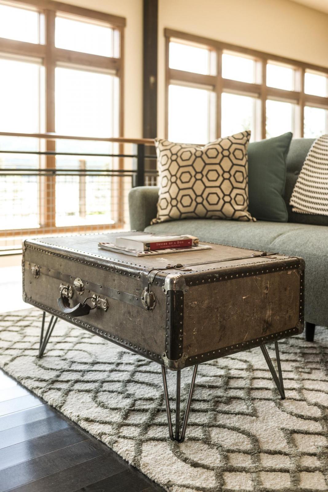 An upcycled suitcase coffee table in a living room.