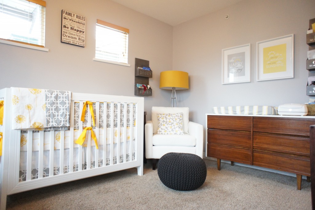 A nursery with a crib and dresser.