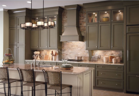 A kitchen with khaki cabinets and a center island.