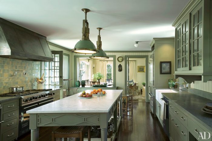 A kitchen with khaki cabinets.