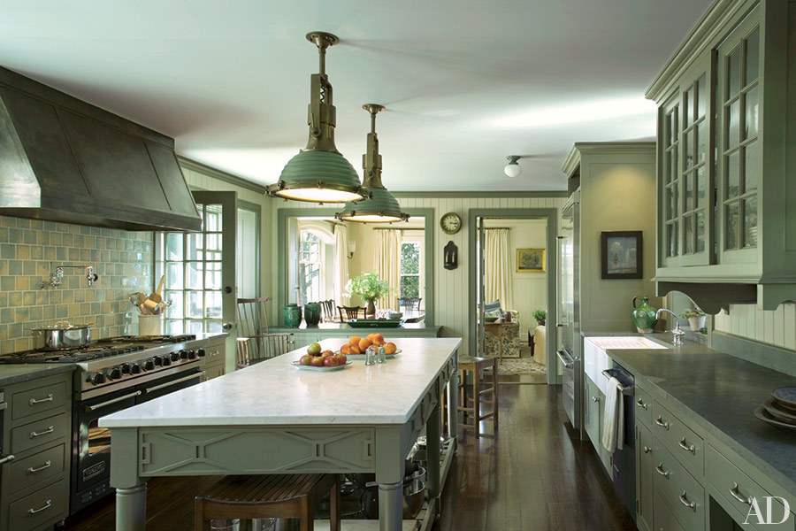 A kitchen with khaki cabinets.