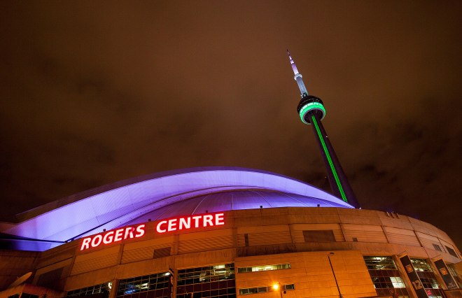 Toronto's Rogers Centre is illuminated at night.