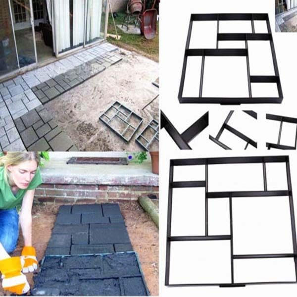 A woman is doing DIY construction on a patio using concrete bricks.