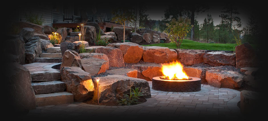 A fireplace in the middle of a yard.