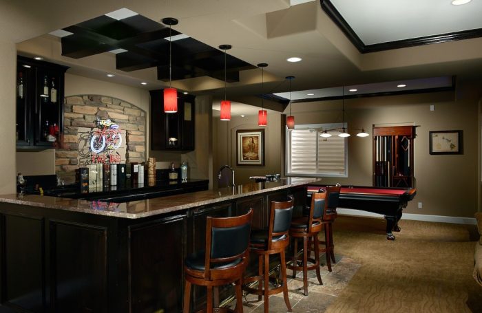 A home bar with pool table.