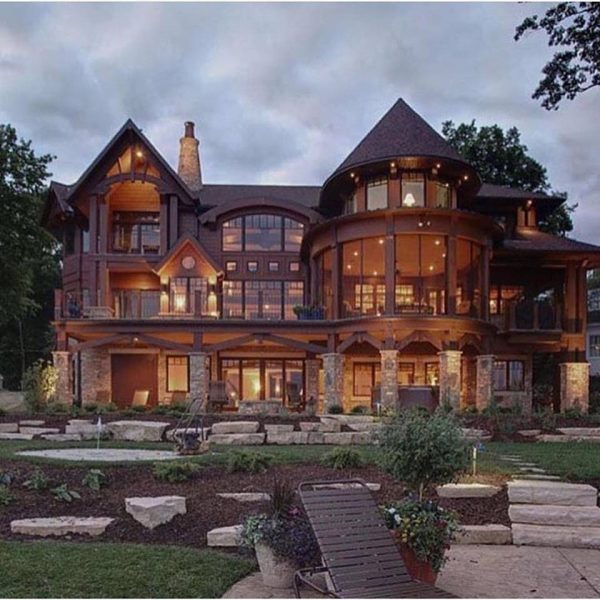 A luxurious log home with a spacious deck.