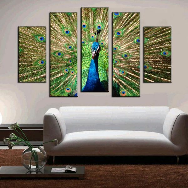 A windowless living room with a peacock on the wall.