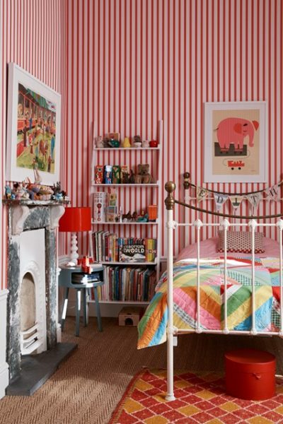 A child's room with striped walls.