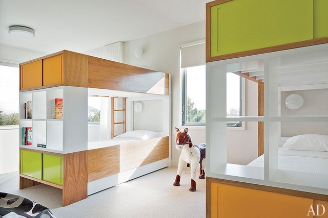 A child's colorful bedroom with bunk beds.