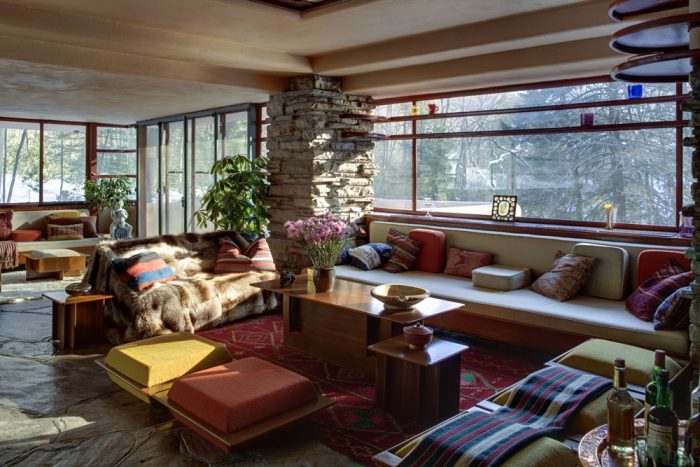 A living room with a Frank Lloyd Wright-inspired fireplace.