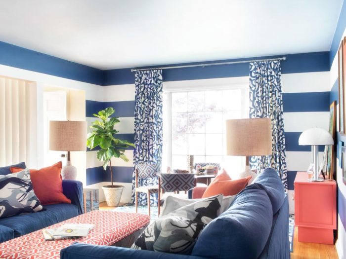 A living room with denim blue striped walls.